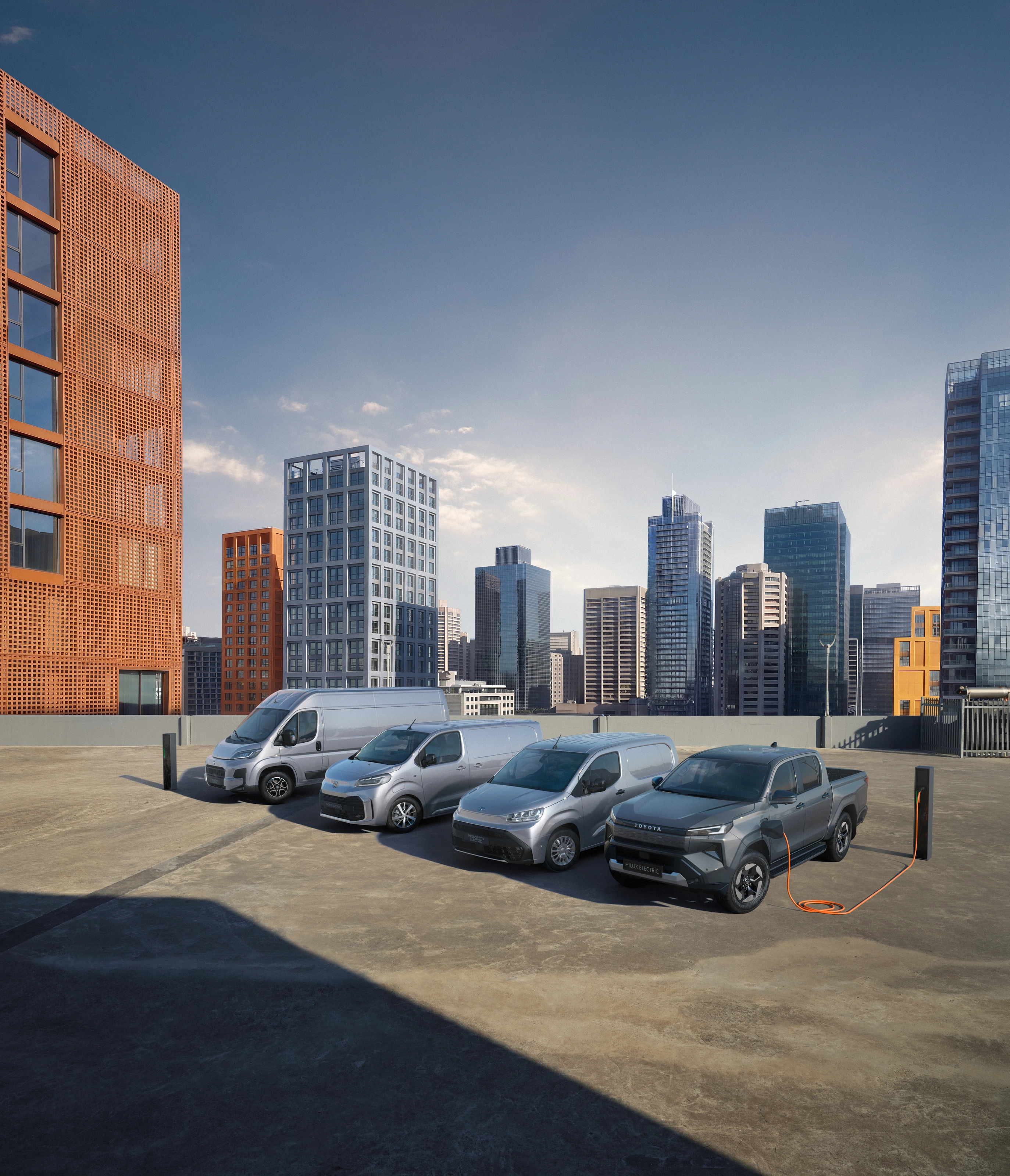 CGI Toyota fleet on a rooftop against a city skyline